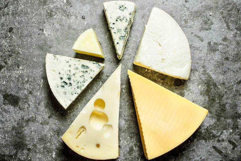 Various pieces of cheese around.&nbsp;