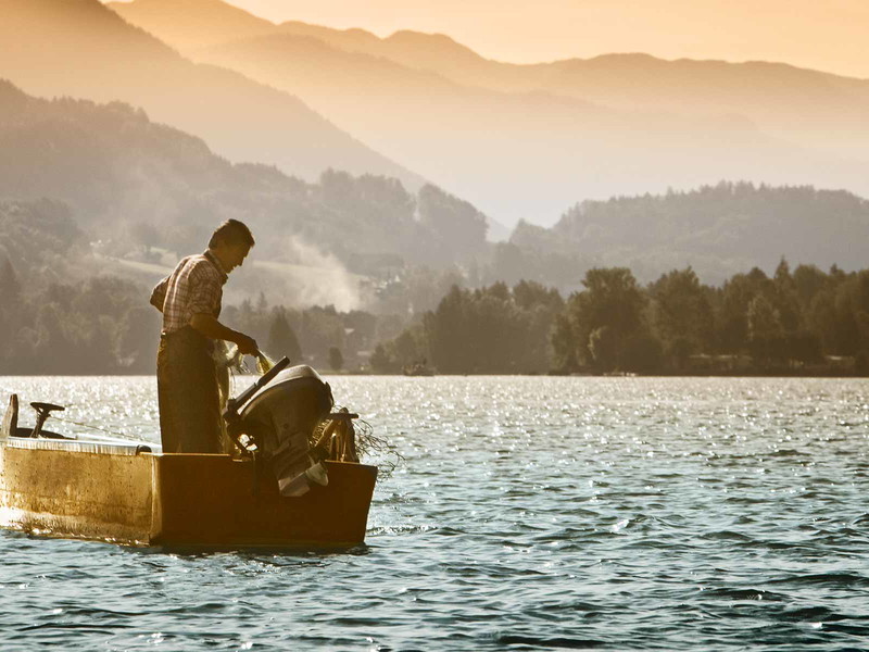 Fischer am Wolfgangsee. Berge, Seen und Fischreichtum in perfekter Symbiose.