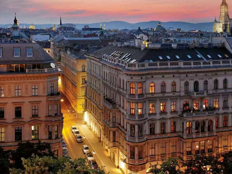 The Ritz-Carlton, Vienna and the skyline of the Austrian capital at dusk.