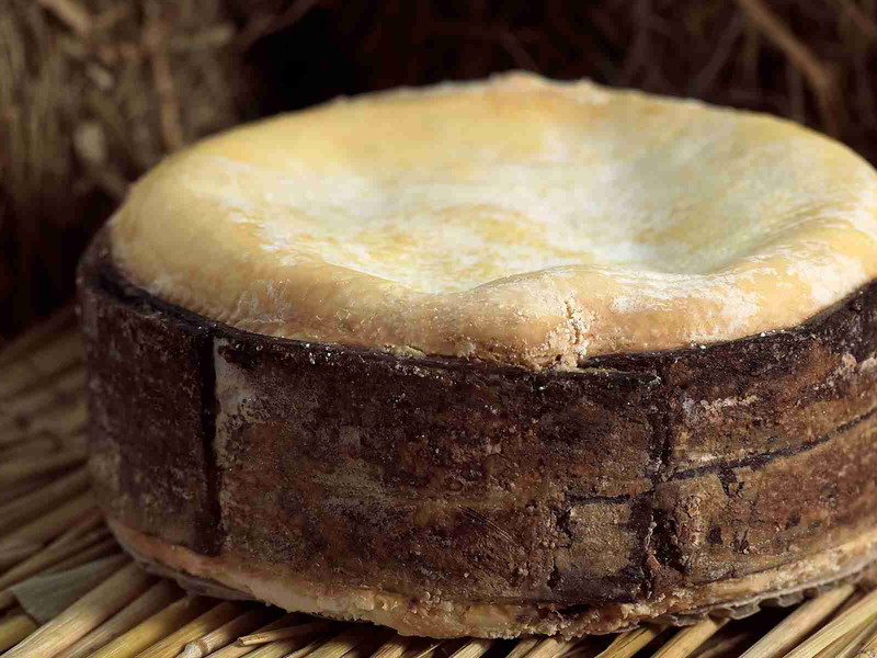 A Vacherin cheese with its spruce band