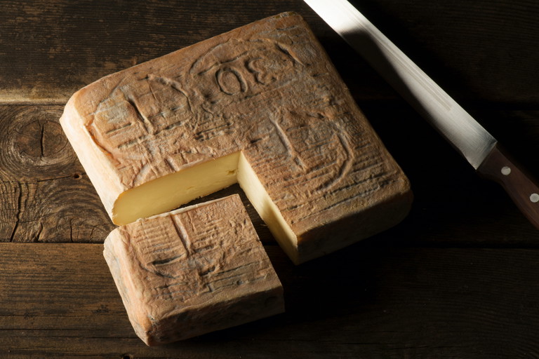 A mature loaf of Taleggio.