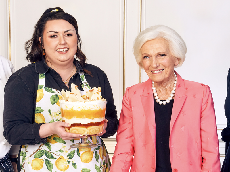 Jemma Melvin with her winning trifle creation and the competition judges.