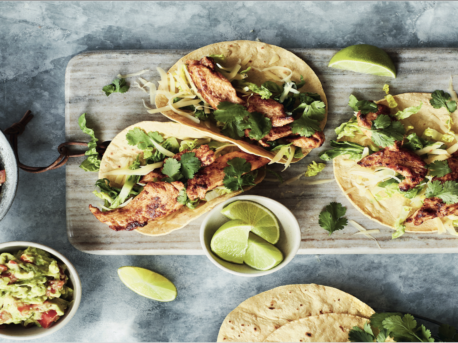 Chicken tacos with salsa &amp; guacamole.