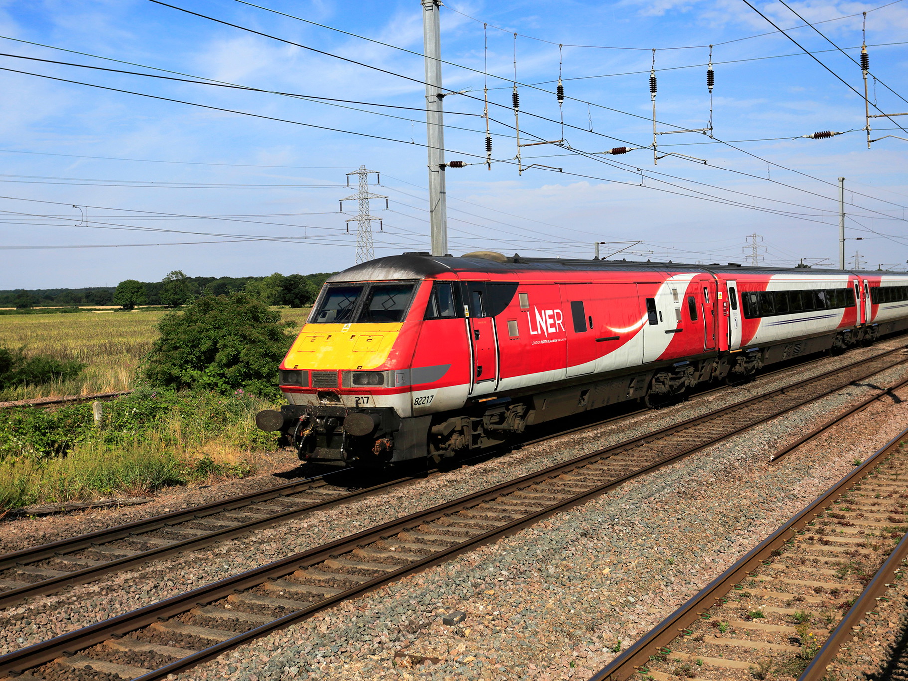 LNER train near Peterborough, Cambridgeshire, UK.