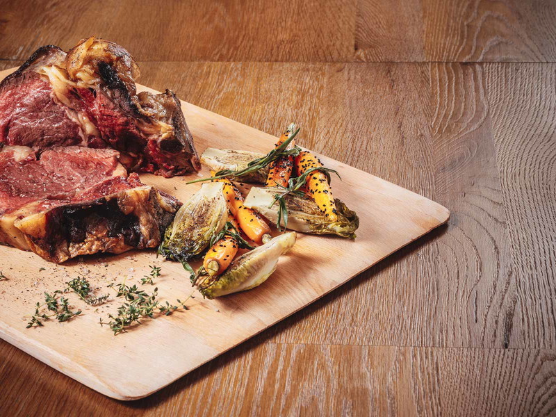 Whole Roasted Rib-Eye with Grilled Carrots topped with Black Sesame and Lettuce Hearts