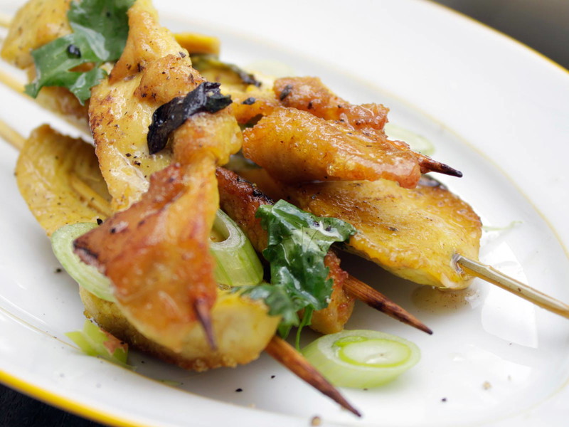 Chicken satay skewers.