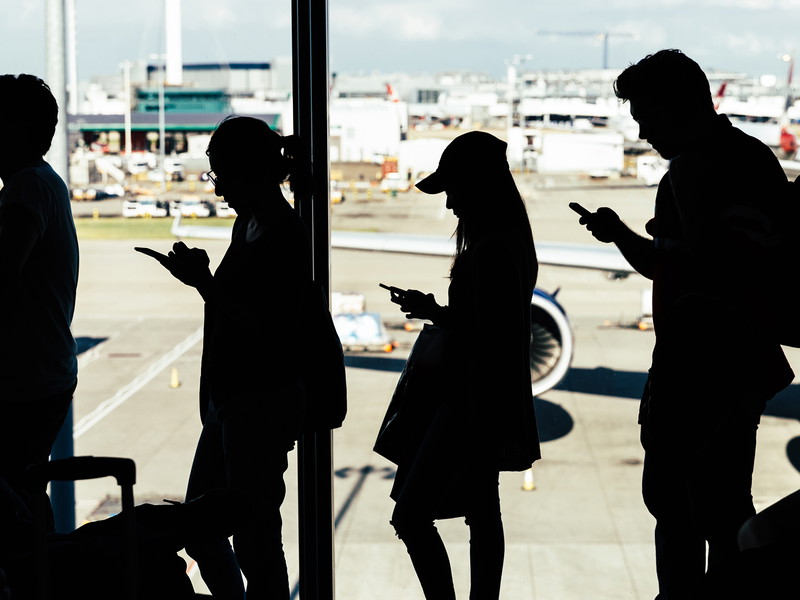 Passengers waiting to board plane at LHR