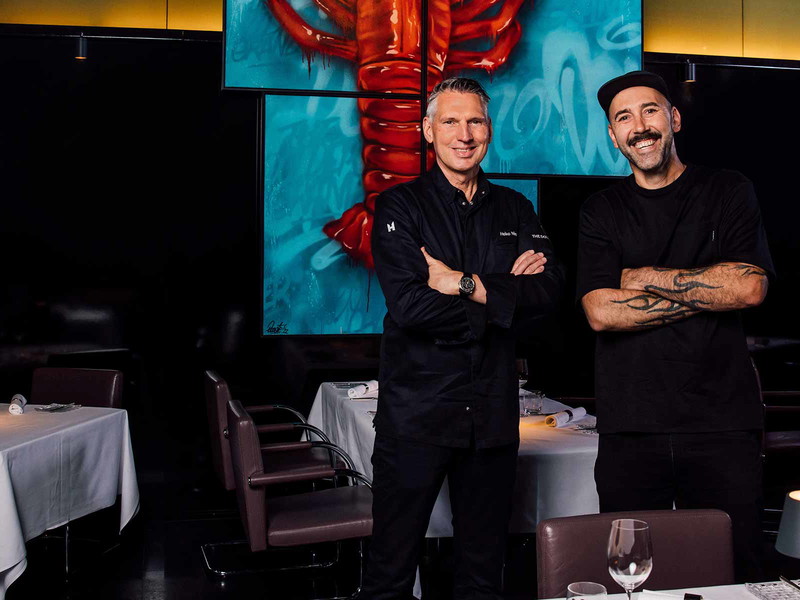 «Dolder»-Culinary Director Heiko Nieder mit dem Schweizer Street Art Künstler Boogie.