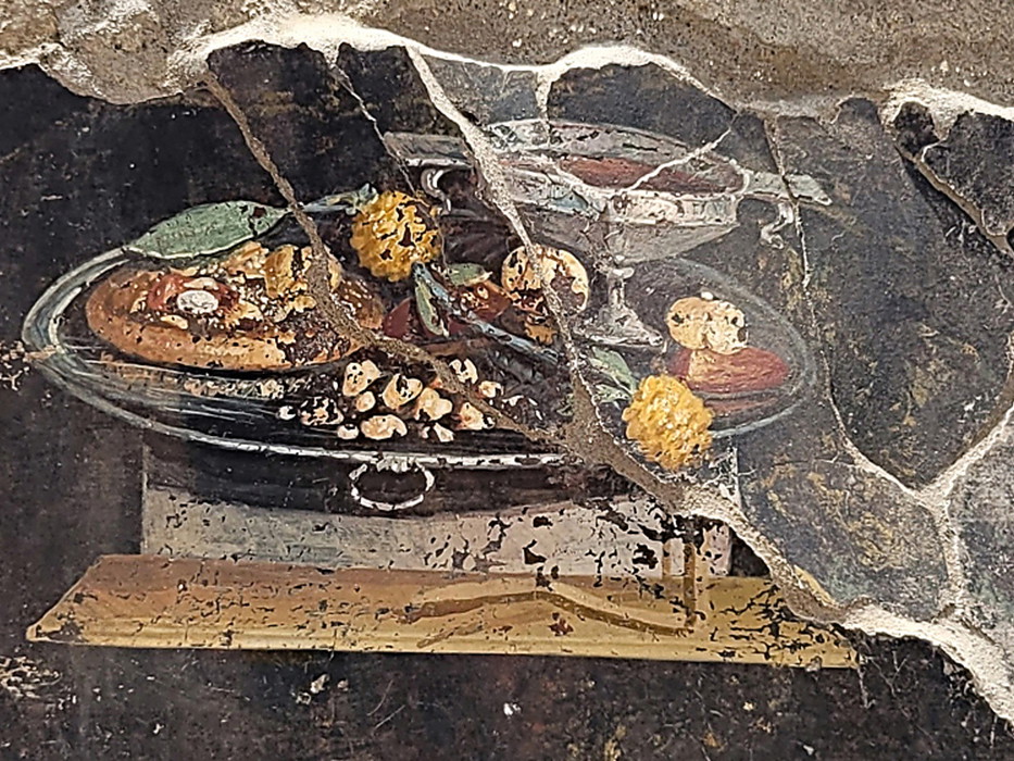 Hier ist ein entfernter Verwandter der Pizza zu sehen – verewigt in einem Fresko.