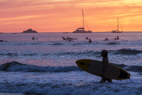 Surfers on Playa Tamarindo, Guanacaste, Costa Rica.