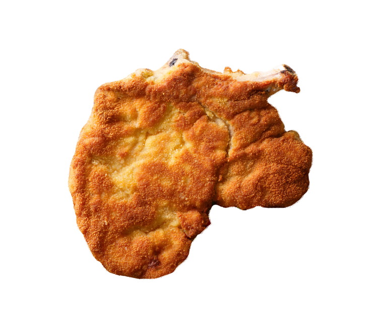Das Mailänder Schnitzel hat etwas einzigartig befriedigendes: Eine knackige Hülle, die ein Herz aus saftigem, weichem Fleisch schützt.