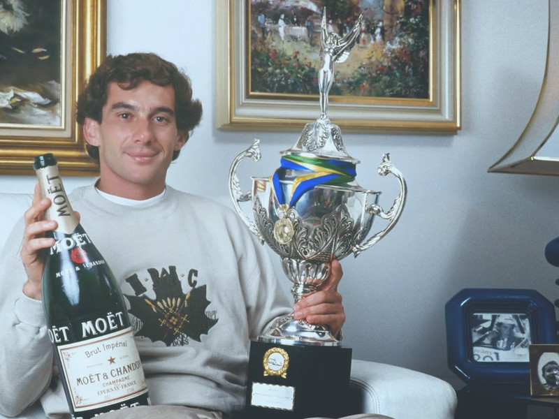 3-time world champion Aryton Senna, celebrating a win with Moët & Chandon.