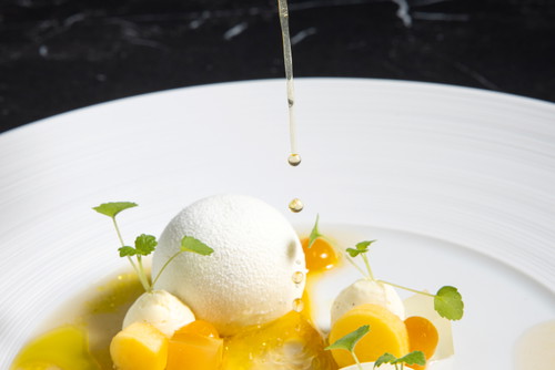 Fine Dining at Apron: Premium ingredients are theatrically prepared in their show kitchen.