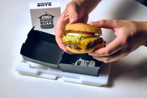 Finally, a human serves the finished sandwich.