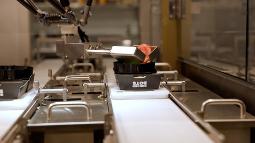 The YuMi handles building each custom burger.
