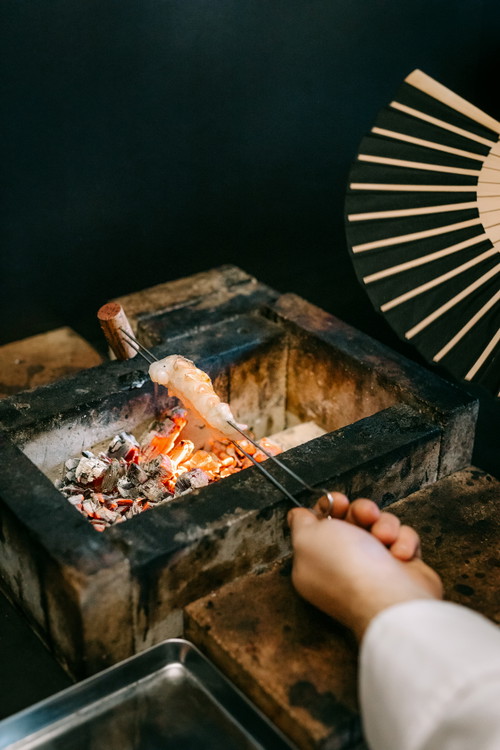Chef Stefan Doubek grills over open fire