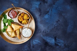 Bhajis and samosas with leek, peas and mint