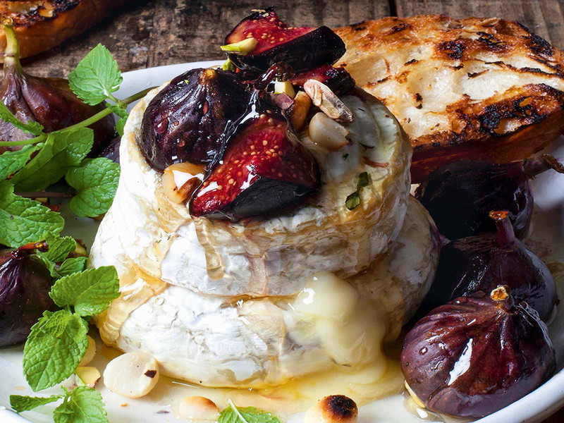Baked Camembert with figs, macadamia brittle and honey
