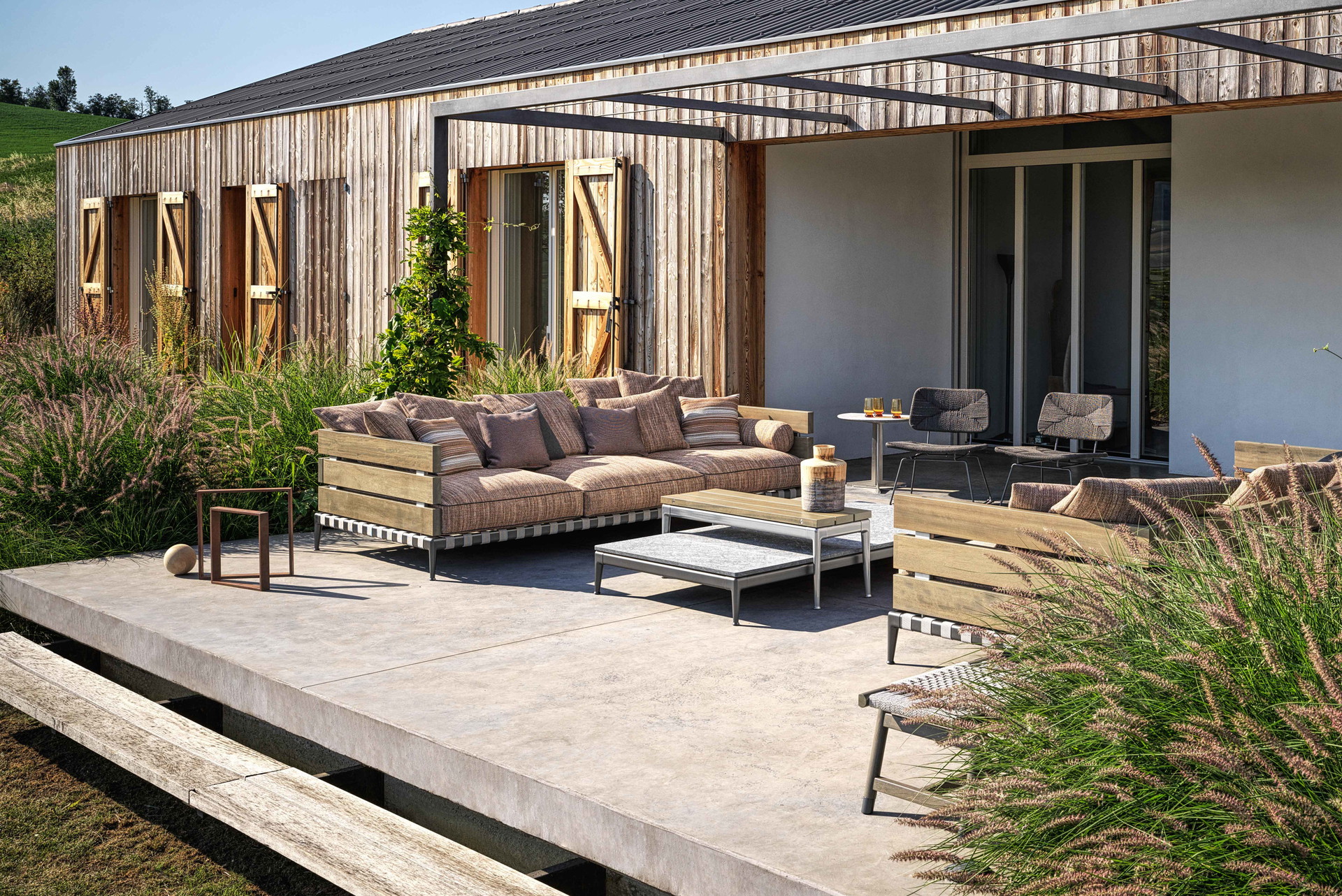 Ansel sofa, Pico Outdoor side tables, Echoes&nbsp;Outdoor armchair, Fly Outdoor side table, Tonga ottoman.