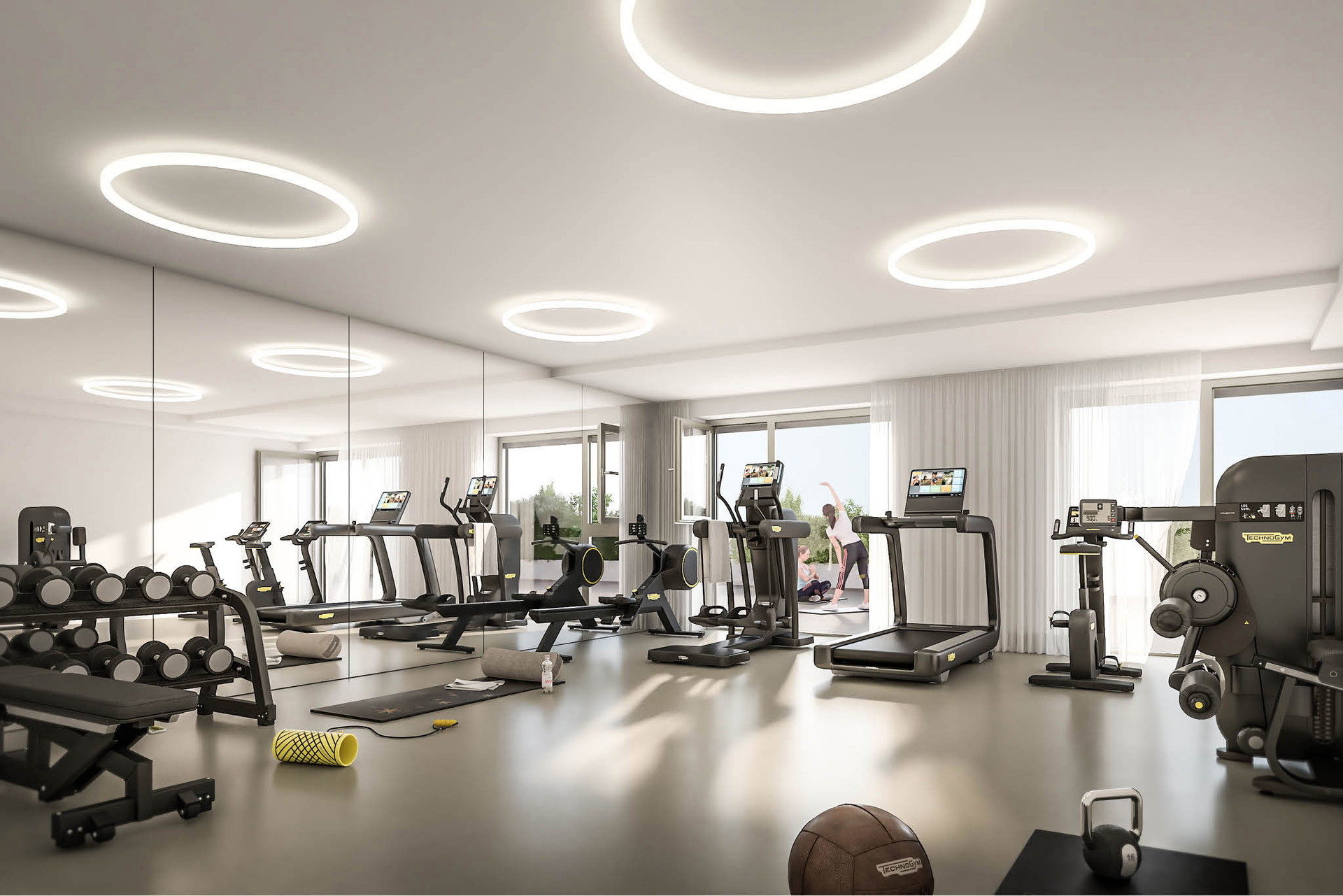 Attraktiver Fitnessraum mit ®Technogym-Geräten