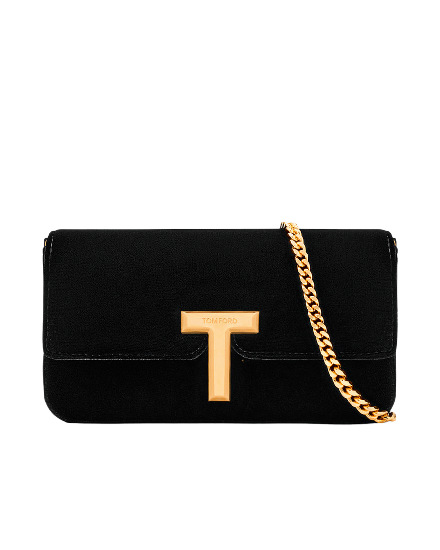 Kleines Schwarzes: Die Clutch aus Samt mit ikonischem T-förmigem Verschluss in Goldfinish ist das perfekte Arm-Piece für elegante Auftritte. Tom Ford,
net-a-porter.com